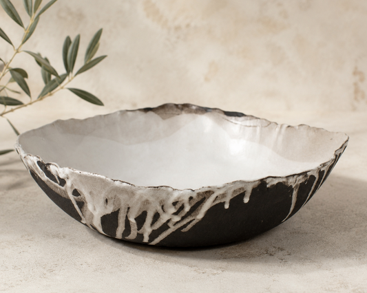 Decorative ceramic bowl with textured surface on a neutral background
