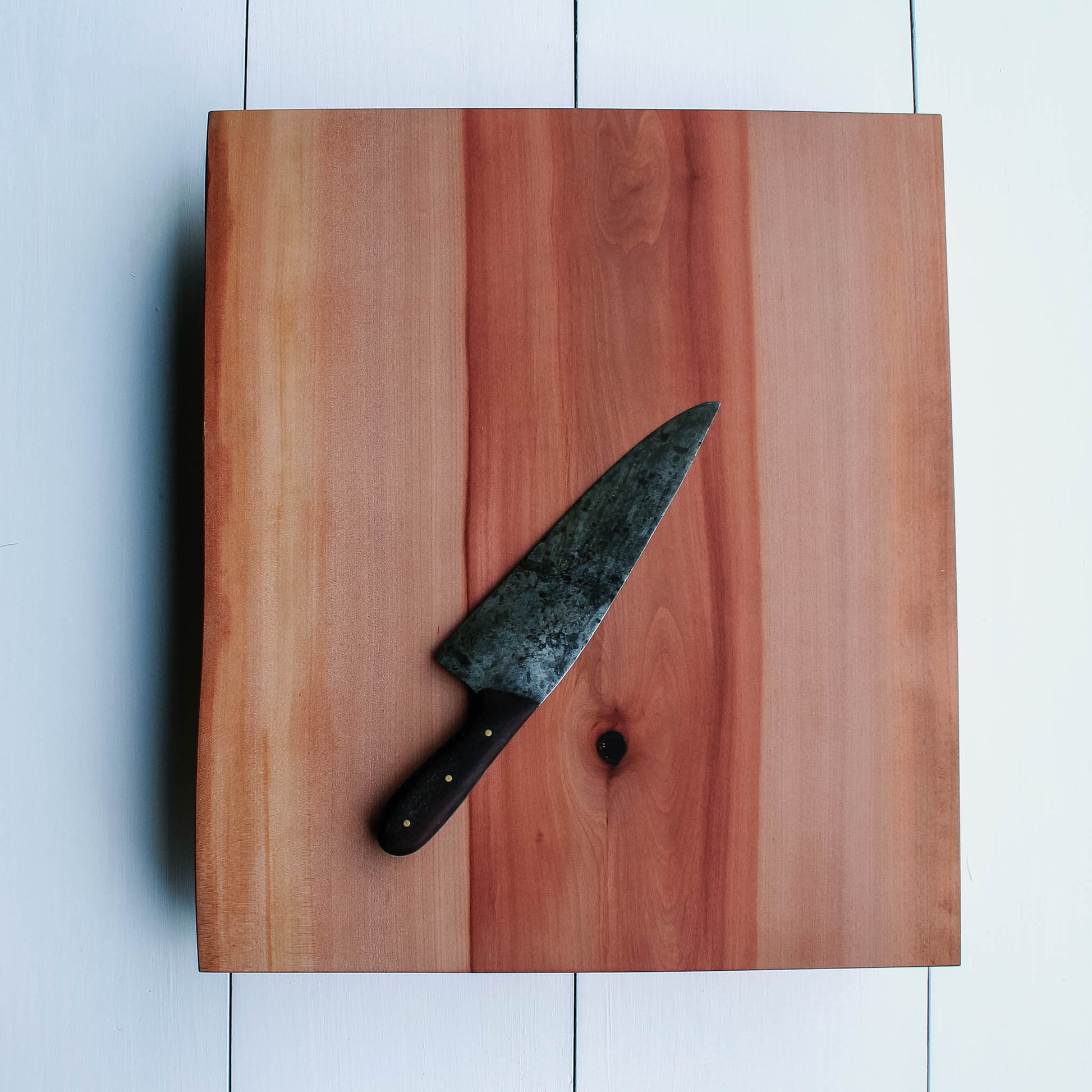 Madrone cutting board with beautiful grain, live edges and engraving