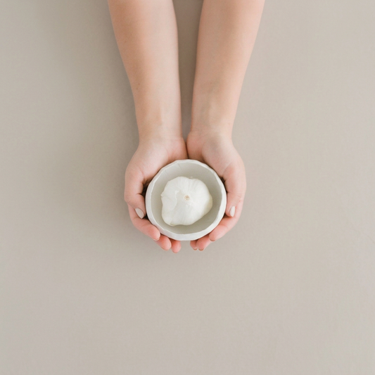 White Matte Mise en Place Bowl held in hands, square photograph.